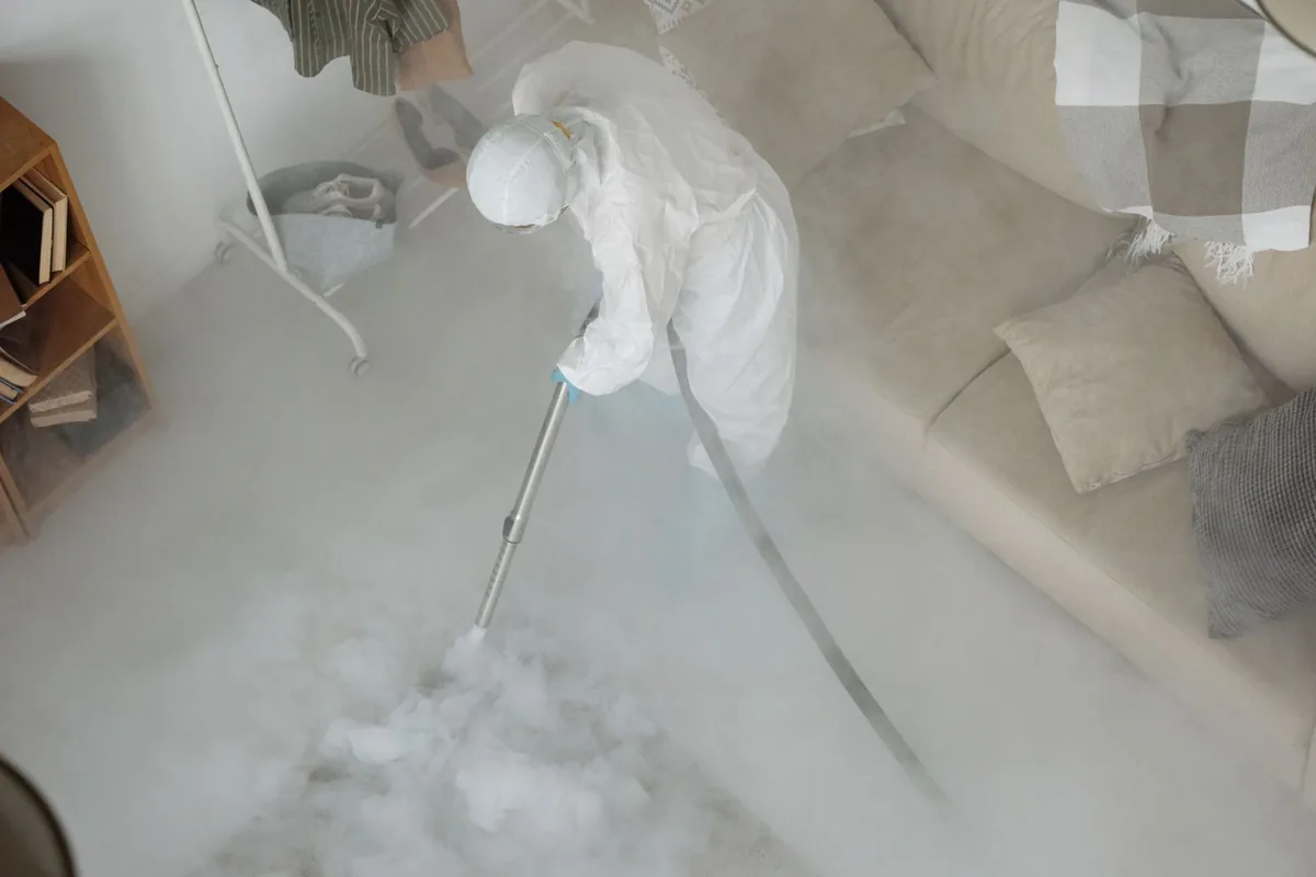 Biohazard cleanup technician in protective equipment, Warrendale, Detroit, MI